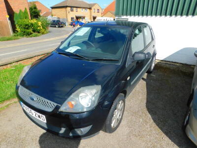 A Ford Fiesta Zetec Climate TDCI, registration PX56 ZWD, 2006, with 5 previous owners, 1.4L diesel, black, approx 122,771 miles, with MOT history, current MOT valid until 15th January 2021, sold with V5 document, no service history, but receipts for works