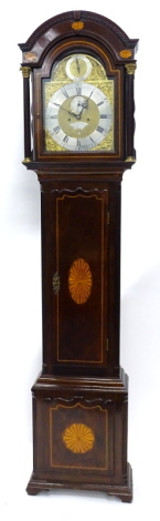 Francis Dusgate, Holt. A late 18th/early 19thC longcase clock, the arched dial with silvered chapter ring, subsidiary seconds and date aperture, elaborate rococo scroll spandrels, eight day four pillar movement, inlaid mahogany case, on ogee bracket feet