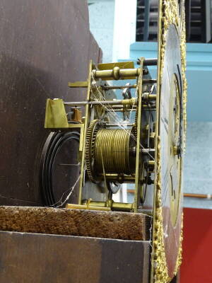 Francis Dusgate, Holt. A late 18th/early 19thC longcase clock, the arched dial with silvered chapter ring, subsidiary seconds and date aperture, elaborate rococo scroll spandrels, eight day four pillar movement, inlaid mahogany case, on ogee bracket feet - 3