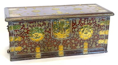 An Eastern Zanzibar type hardwood chest, the hinged lid enclosing a vacant interior with candle box, decorated overall with brass studs and pierced engraved lock plate, spandrels, hasp, etc., 110cm wide. Provenance: The Estate of Miss Rachel Monson.