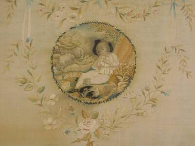 An early 19thC silk embroidered picture, decorated centrally with a young boy, sheep, etc., surrounded by a floral cartouche, embellished with ribbons, wheat ears, etc., 34.5cm x 42cm. - 2