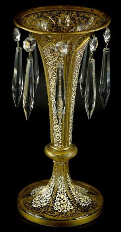 A 19thC table lustre, decorated with raised white enamel in Middle Eastern style, within gilt borders, 25cm high.