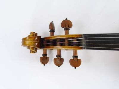 A 20thC violin, with one piece back, length of back 35.5cm and a bow. - 4