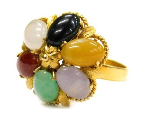 A multi stone set dress ring, set with six oval cut semi precious stones, in a yellow coloured frame, with Chinese marking, believed to be gold plated, ring size M½.