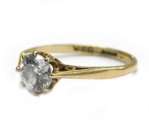 A 9ct gold solitaire ring, set with imitation diamond stone, in eight claw setting, with V splayed shoulders, ring size N, 1.7g all in.