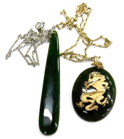 Two items of jade set jewellery, comprising a jade dragon pendant on gold plated chain, with certificate of authenticity, boxed, and a single jade pendant on silver plated chain. (2)