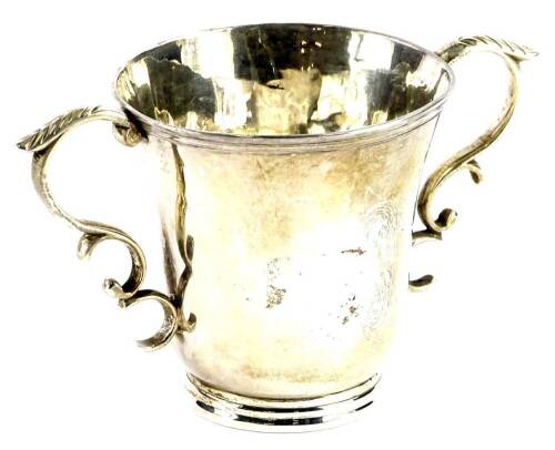 A continental silver coloured metal two handled cup, of tapering form with a moulded rim and reeded base, bearing marks to underside, 7cm high. Provenance: The Estate of Miss Rachel Monson.