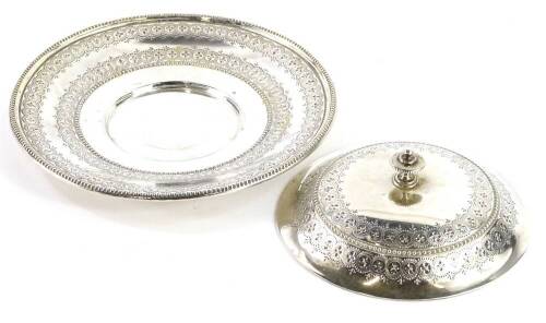 A Victorian silver butter dish, the lid and base engraved with roundels, leaves, etc., each applied with Victorian lozenge registration mark, lacking glass liner, London 1871, by Joseph & Edward Bradbury, 9oz. Provenance: The Estate of Miss Rachel Monson.