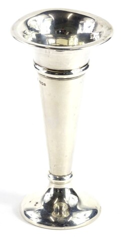 A George V silver specimen vase, of tapering form, on a domed foot, loaded London 1919, 16cm high.