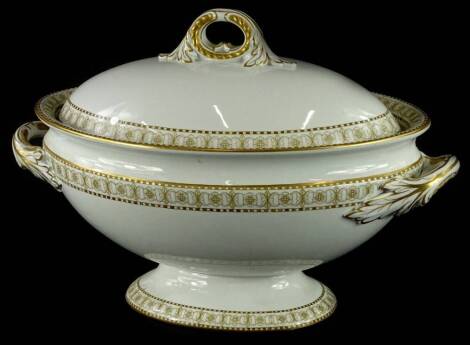 A Royal Worcester porcelain two handled tureen and cover, decorated with gilt floral and leaf bands within chequered borders, printed marks to underside, 38cm wide.