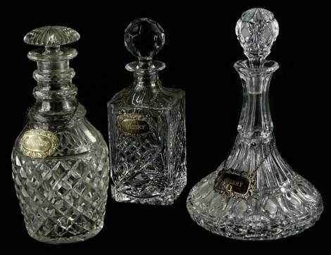 Three cut glass decanters, a ship's decanter and stopper with label, a triple ring necked decanter with brandy label and a plain square section decanter with a whisky label. Provenance: The Estate of Miss Rachel Monson.