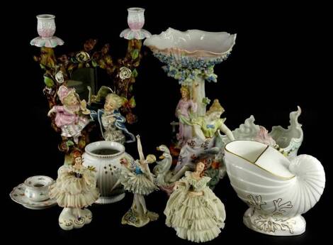 A collection of Dresden and other continental porcelain, to include a candlestick and mirror group centrepiece, a chariot type stand mounted with swans, a Thuringia type pot pourri vase, lacking lid and a Derby white and gilt porcelain Nautilus shell spoo