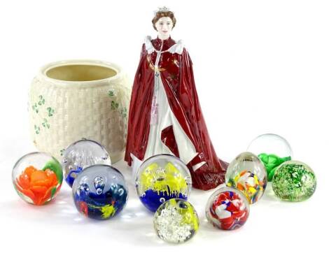 A collection of glass and porcelain, to include a Belleek ginger jar, biscuit barrel (lacking lid), a Royal Worcester figure to celebrate Queen Elizabeth II 80th birthday in 2006 and various coloured glass paperweights.