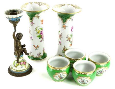 A pair of Dresden porcelain cylindrical vases, each with a flared rim decorated with flowers, a set of four continental porcelain miniature jardinieres with a gilt metal and porcelain candlestick (7).