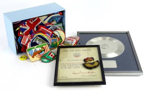 A card for good service, awarded to a Gunner J Cummings of the Royal Artillery, facsimile signature of Lord Louis Mountbatten, dated May 1946, a military badge, a presentation disc for loyal service to Decca 1951-1980 and various fabric badges (a quantity