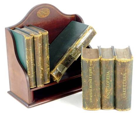 An Edwardian mahogany and boxwood strung book rack, containing various small books, to include a Gazetteer. Provenance: The Estate of Miss Rachel Monson.