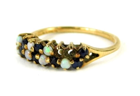 A 9ct gold dress ring, set with blue stones and imitation opals (some missing), in claw setting, ring size K, misshapen, 1.8g all in.