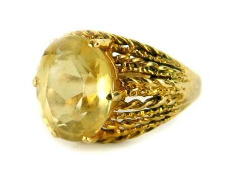 A 9ct gold dress ring, set with oval cut citrine stone, in six claw setting, with pleated design shoulders, ring size L½, 4.4g all in, boxed.