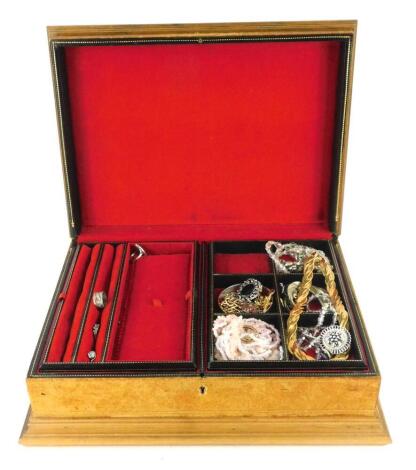 A tan faux leather jewellery box and contents, comprising four silver dress rings, gold plated necklaces, bar brooches, etc. (one box).