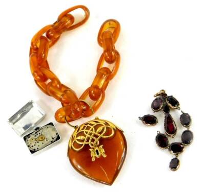 Two items of jewellery, comprising a faux amber pendant and chain, with yellow metal mount, a watch case and a Victorian paste stone set pendant (AF).