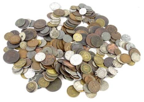 A large quantity of British and foreign coins, a coin bracelet and a double headed coin.