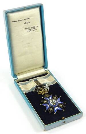 A Serbian Kingdom Order of St Sava III medal, in blue and white enamel, dated 1883, with original ribbon and box.