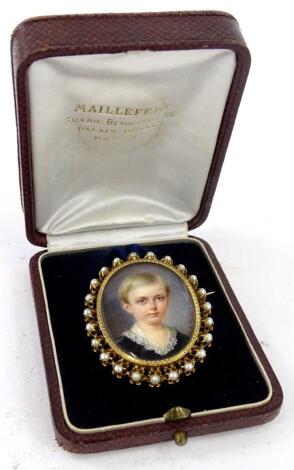 19thC School. Miniature portrait of a young boy wearing a black garment with lace collar, within gilt metal frame backed with mother of pearl, the leather box stamped AR.