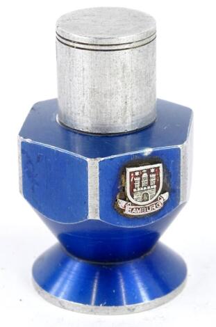 An early to mid 20thC turned aluminium lighter, decorated with the crest of Hamburg, 7cm high. Provenance: Made by a German prisoner of the Second World War living in this country.