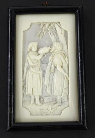 A late 19thC carved ivory biblical panel, depicting a young lady giving water to a man, possibly Dieppe, in ebonised frame, 14cm x 9cm.