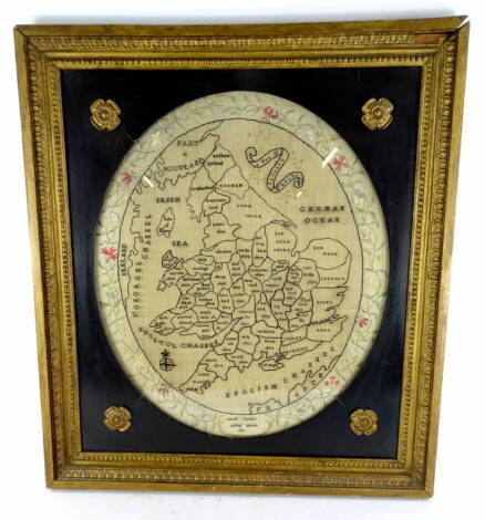 An early 19thC sampler, stitched with a map of England, part of Scotland, Ireland, Wales etc., signed Sarah Fielder, Abbey House, 1810, in gilt and ebonised frame, 67cm x 58.5cm overall.