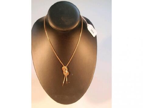 A knotted foxtail chain necklace