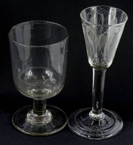 An 18thC wine glass, with tapering bowl, engraved with wheat ears etc., a plain column and fold over foot, 16cm high and a 19thC rummer.