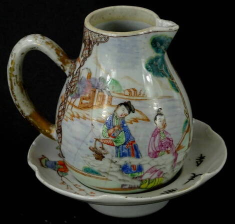 A late 18th/early 19thC Chinese export milk jug, of baluster form, decorated with figures (AF), 10cm high and a cabinet saucer, 13cm high (2).