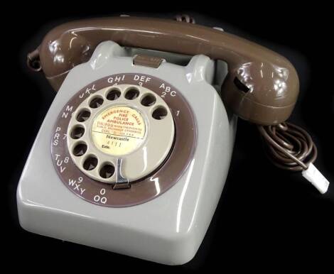 A late 1950's GPO grey telephone, with on/off bell switch.