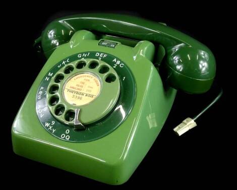 A 1960's GPO 706 green telephone, with bell on/off switch.