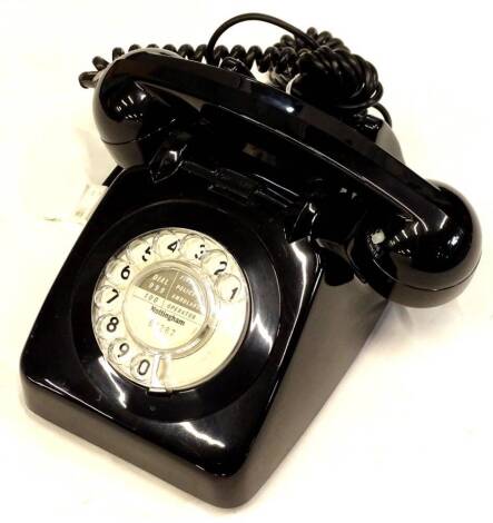 A 1960's GPO 706 type telephone, with bell on/off switch and unusual press to mute switch on handset.