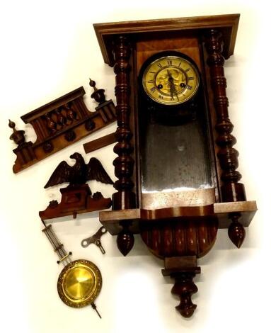 A Vienna type wall clock, in walnut case, the dial with pressed decoration of a pheasant, surrounded by a paper chaptering with Roman numerals, 22cm high.