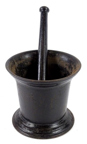 A 19thC painted cast iron pestle and mortar, the mortar 17cm high.