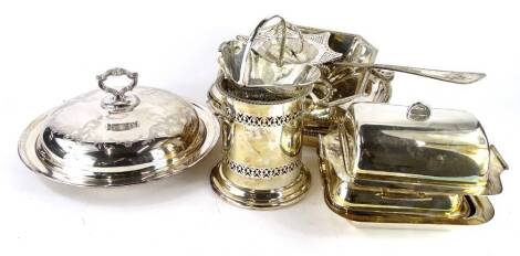 A collection of silver plate, to include a circular tureen and cover, oval tureen and covers, an Art Deco butter dish, bottle stand, etc.