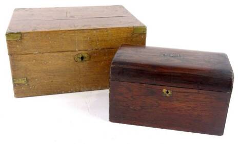 A Victorian rosewood tea caddy, the hinged lid with decorative brass lettering to centre (tea) enclosing tow lidded divisions, 21cm wide, and a brass bound writing box, lacking interior. (2)