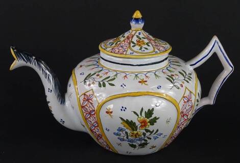 A French faience teapot, decorated with compartments of flower sprays, geometric devisers, etc., handwritten marks to underside, 26cm wide.