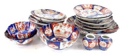 A collection of late 19th/early 20thC Imari porcelain, to include various shaped dishes, bowls, a pair of small vases and a larger charger, 30cm diameter.