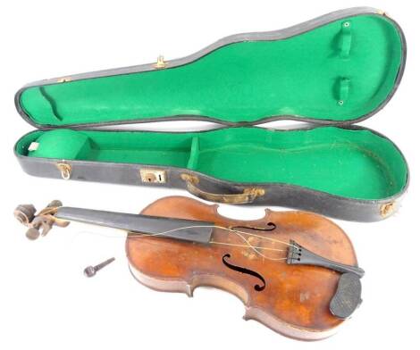 An early 20thC violin, with a two piece back, lacking label, no bow, length of back 36cm.