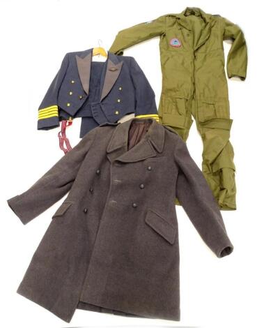 A set of Royal Air Force type green overalls, heavy grey gentleman's overcoat, and an RAF uniform with four gilt bars to the sleeve, and various plated tankards and a tray one engraved 'GP CAPT H.A.W DREW, hq 11gp, jan 88 - feb 90.Provenance; formerly the