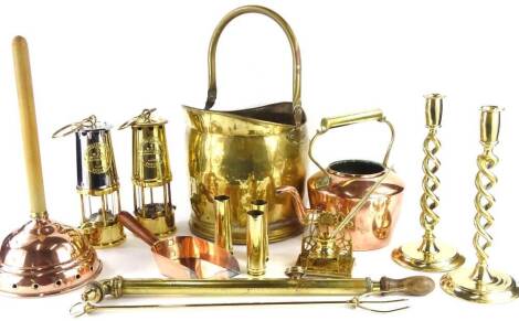 A quantity of metalware, to include miner's lamp, copper kettle, brass syringe, barleytwist brass candlesticks, copper posher, etc.