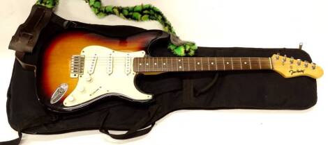 A Jim Haxley brand electric guitar, 100cm long with canvas case.