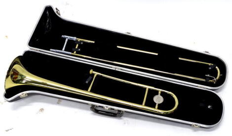 A Bundy brass trombone in a fitted case.