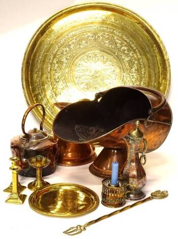 A quantity of metal ware, to include a copper coal scuttle, copper kettle, candlesticks, large Indian tray etc. Provenance: The Estate of Miss Rachel Monson.