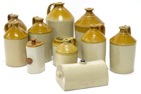 A quantity of stoneware bottles, various sizes, two stoneware bed warmers, no makers stamps.