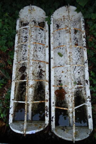 A pair of rectangular cast iron agricultural feeding troughs, 102cm long.